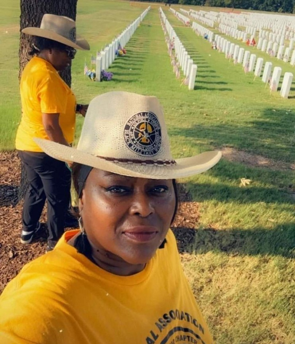 Post 828 Legionnaire Sharon Brown, along with The National Association of Black Military Women-San Antonio Chapter, picking up the flags at Ft Sam Cemetery